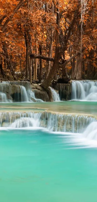 Serene autumn waterfall with turquoise waters and orange leaves.
