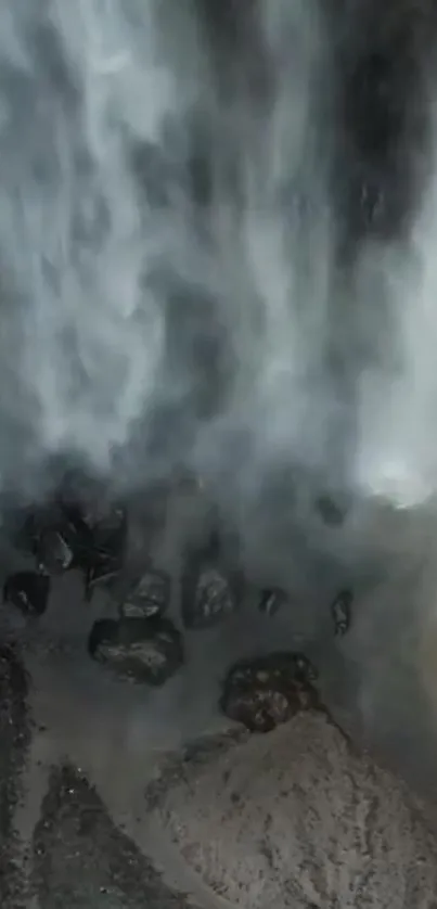 Serene waterfall cascading over dark rocks in nature.