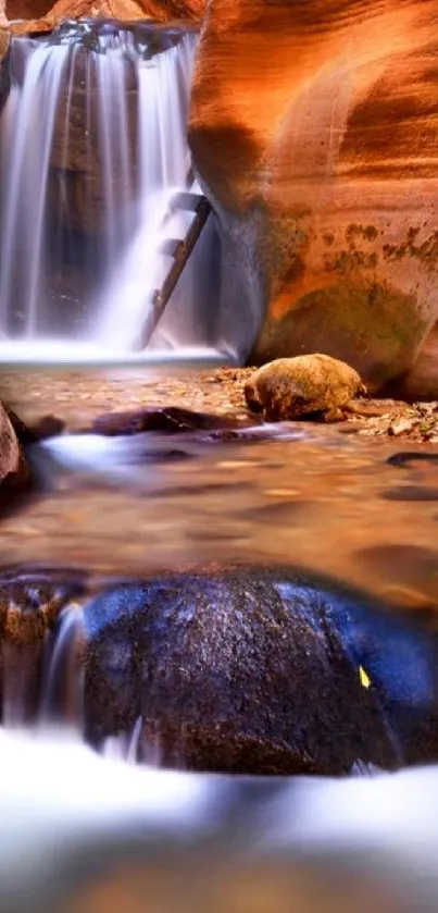 Canyon waterfall with tranquil flowing water.