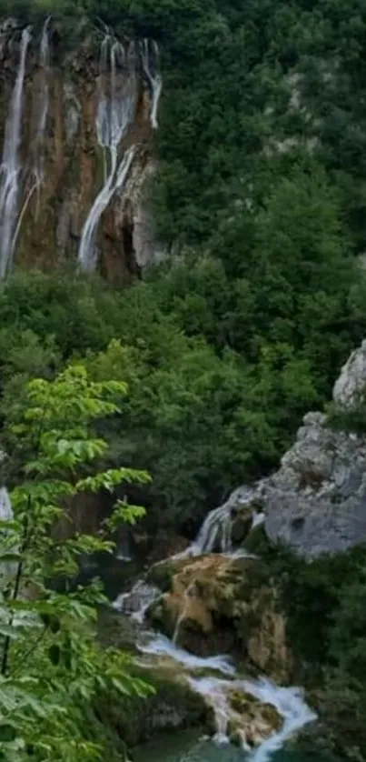 Serene waterfall cascading through lush green forest landscape.