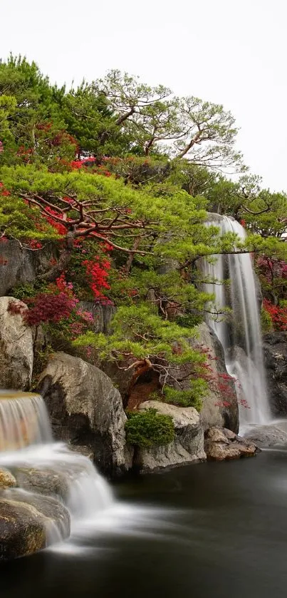 Serene garden waterfall with vibrant greenery and cascading water.