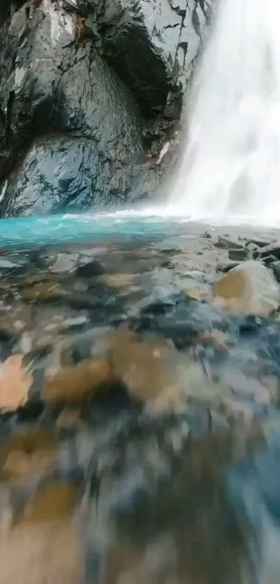 Serene waterfall cascading into a rocky pool.