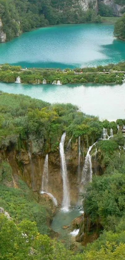 Serene view of a scenic waterfall surrounded by lush greenery.