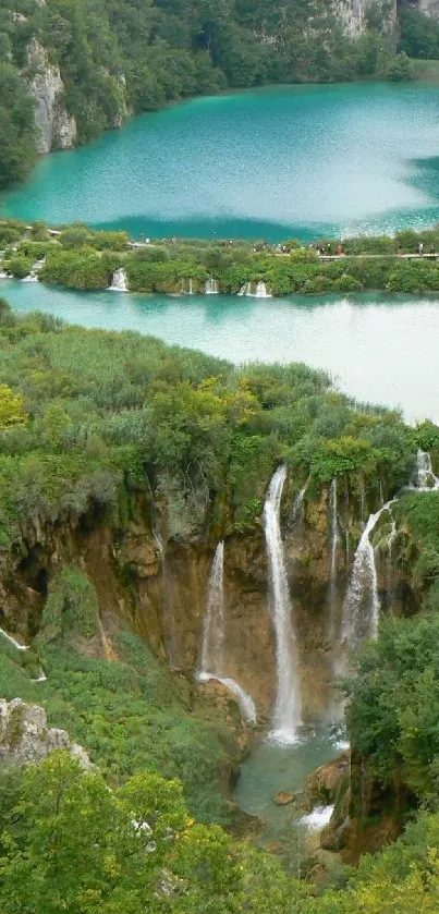 A serene view of cascading waterfalls in lush green surroundings.