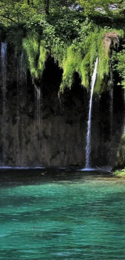 Serene waterfall with lush greenery and teal waters.