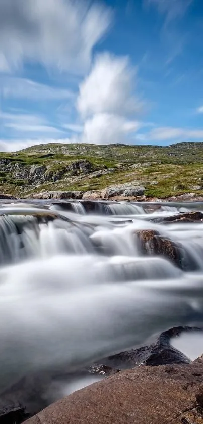 Serene waterfall with dynamic clouds in a lush landscape.