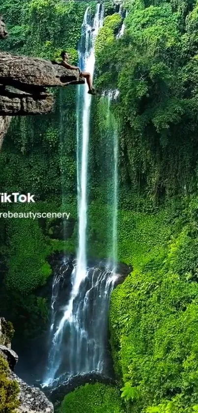 Majestic waterfall in a lush jungle with a cliff view.