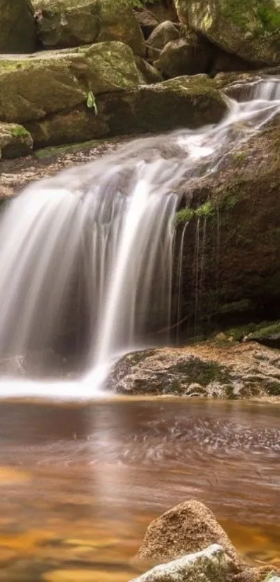 Serene waterfall with rocks and greenery in a peaceful natural setting.