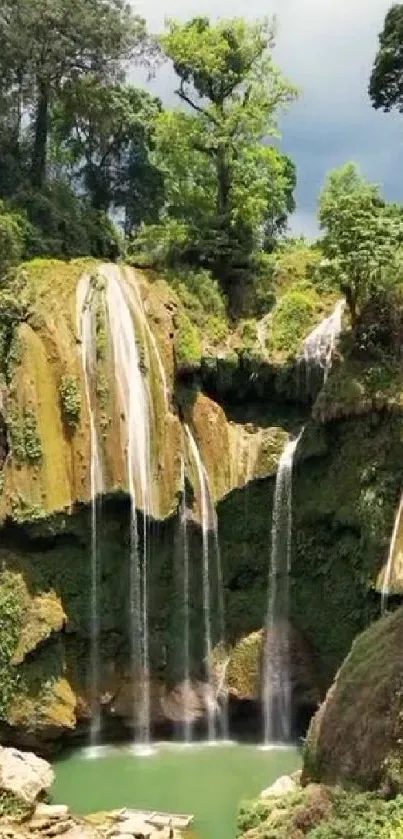 Beautiful waterfall surrounded by lush greenery.