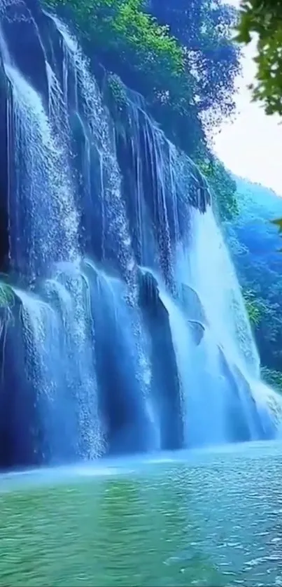 Beautiful cyan waterfall surrounded by lush greenery, reflecting tranquility.