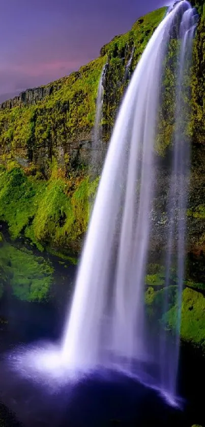 A serene waterfall cascading over vibrant green cliffs at sunset.