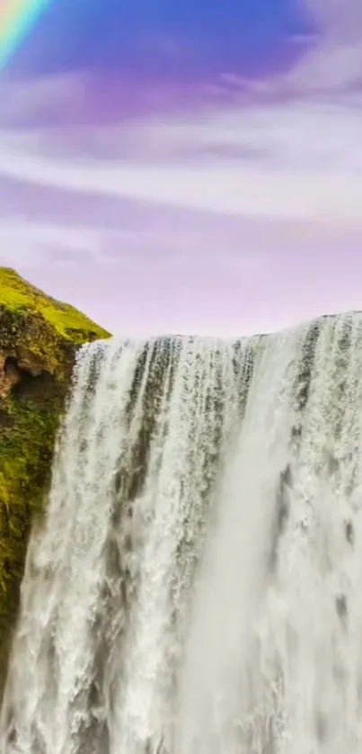 Majestic waterfall with a vibrant rainbow in a serene lavender sky background.