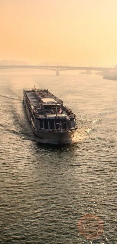 Boat traveling along a foggy river at dawn, creating a tranquil scene.