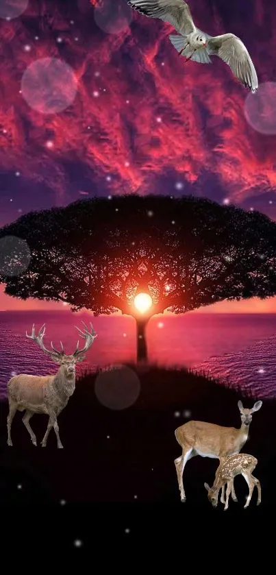 Majestic wildlife and tree silhouette against a vivid sunset sky.