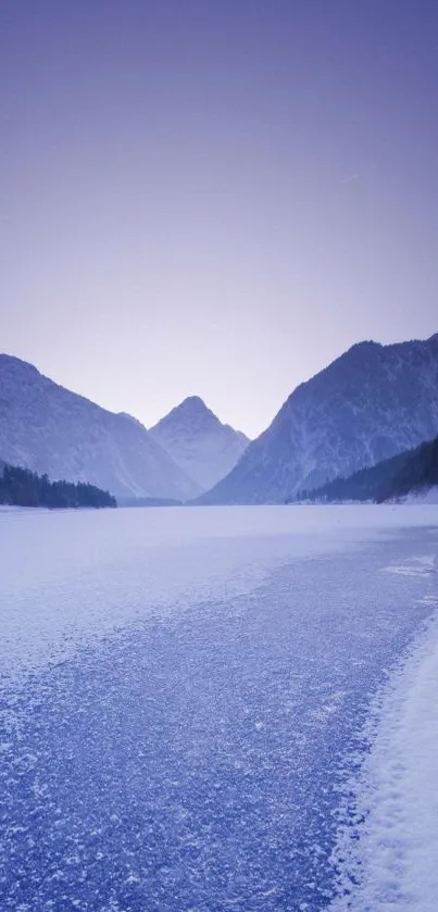 Serene winter mountain landscape with snow and purple sky.