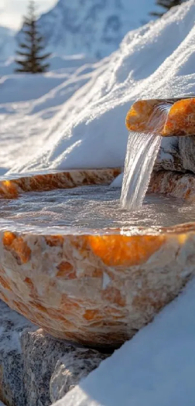 A stone fountain amidst snow with water flowing gracefully.