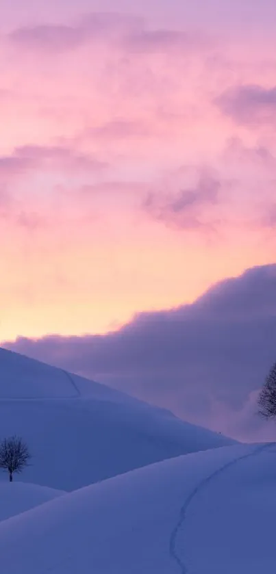 Snowy hills with trees at sunset under a lavender and pink sky.