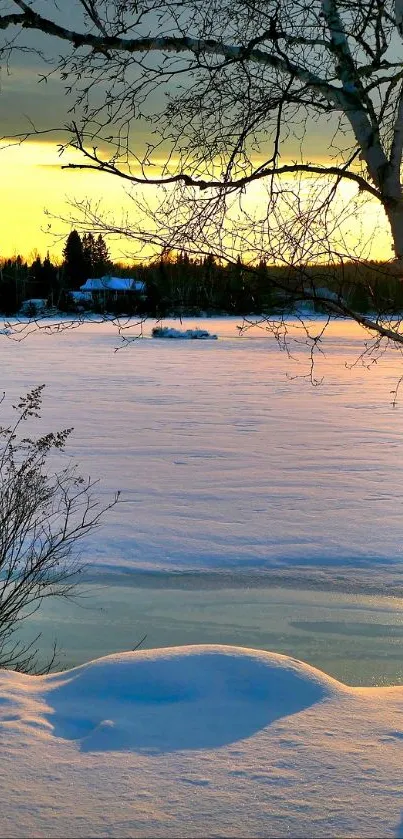 Serene winter sunset over a snowy lake.