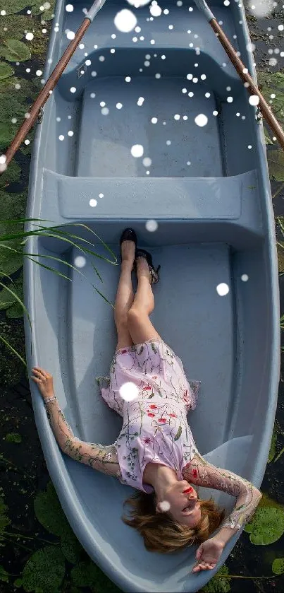 Woman lying in blue boat with lily pads.