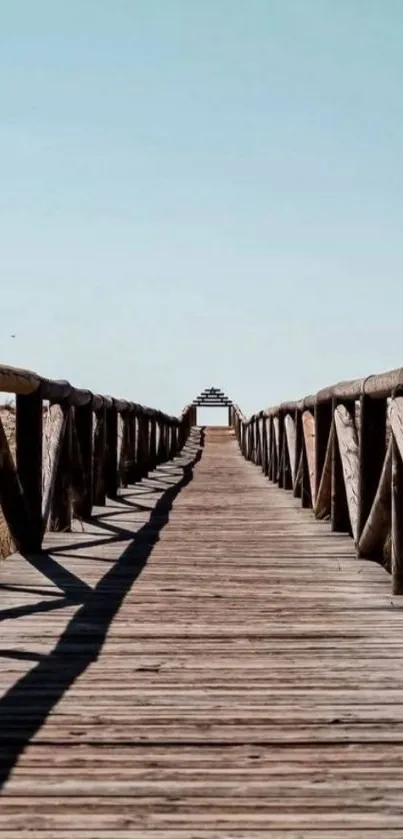 Serene wooden pathway with clear blue sky