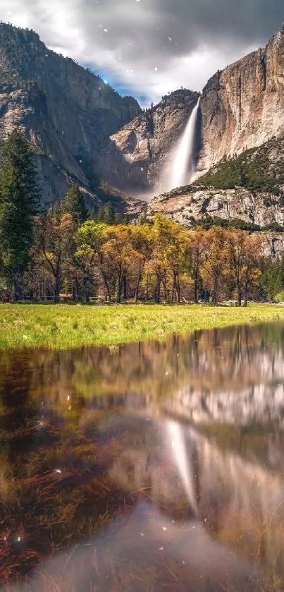 Stunning Yosemite waterfall with reflective lake view.