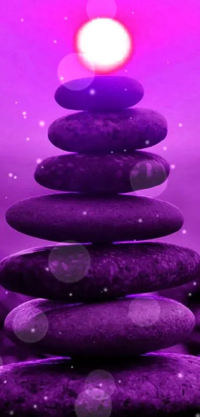 Zen stone stack with purple glow mobile wallpaper.