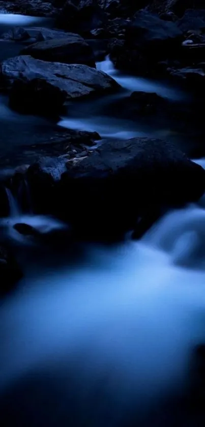 Dark blue stream with flowing water and rocks.