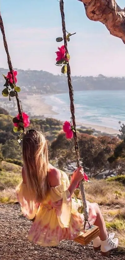 Woman on a swing overlooking a beach and ocean.