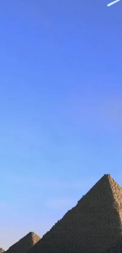 Tranquil mobile wallpaper featuring pyramids under a clear blue sky.