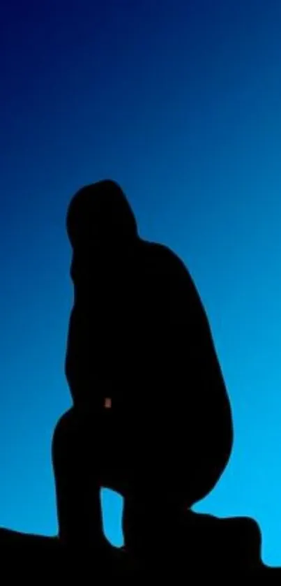 Silhouette against blue gradient sky wallpaper.