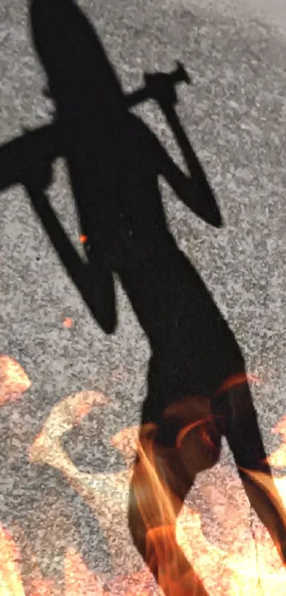 Shadow silhouette of a person carrying an object on a dimly lit sidewalk at night.