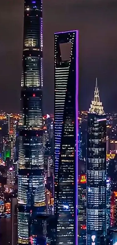 Shanghai skyline at night with illuminated skyscrapers and city lights.