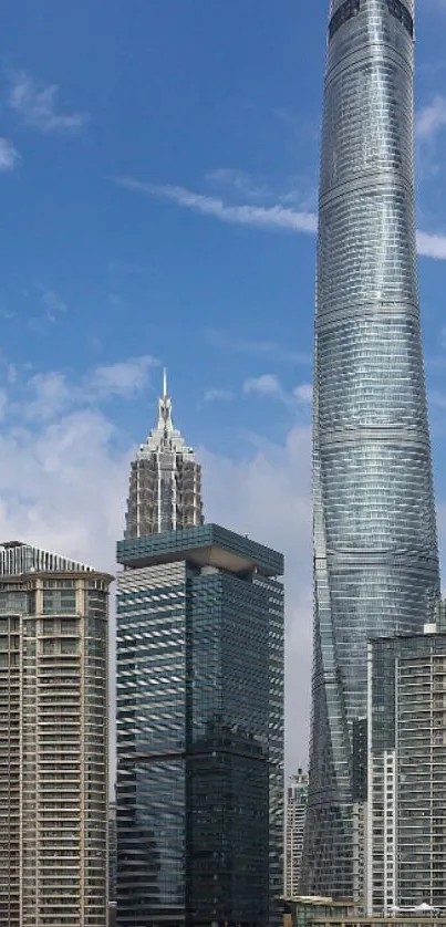 Tall modern skyscraper against a blue sky.