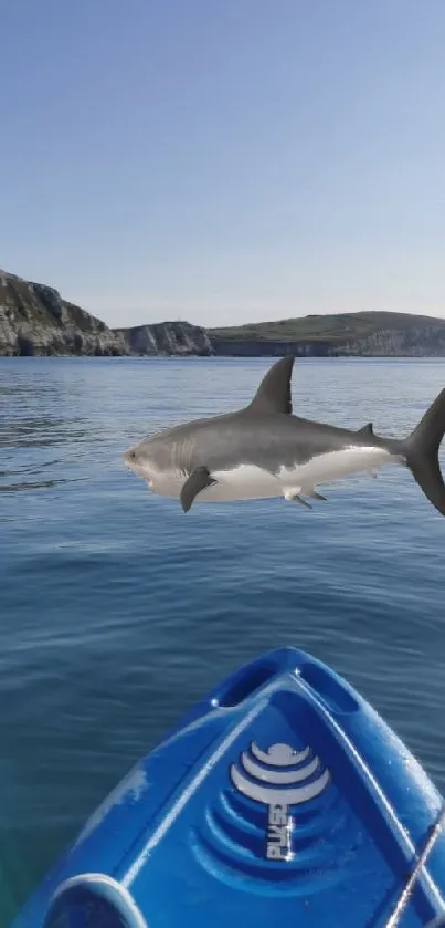 Kayak with a shark in blue ocean under clear sky.