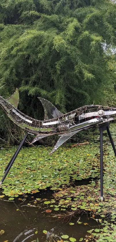 Sculpture of a shark in a lush green pond with water lilies.