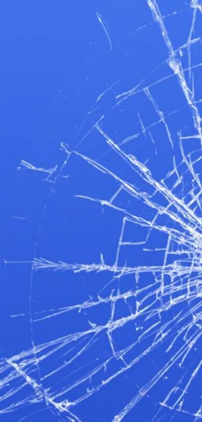 Shattered glass on vibrant blue wallpaper for mobile phones.