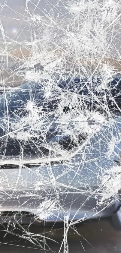 Shattered glass effect with car reflection on mobile wallpaper.