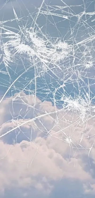 Shattered glass effect over a cloudy sky background.