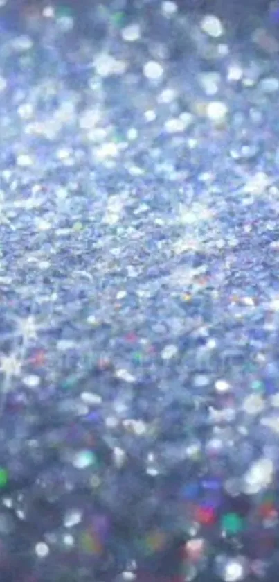 Blue sparkling glitter wallpaper with shimmering texture.