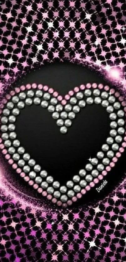 Heart-shaped diamond design with pink accents on black background.