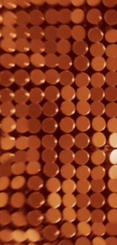 Shiny copper circles on a mobile wallpaper.