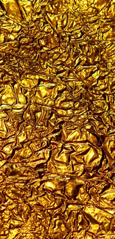 Luxurious shiny gold textured wallpaper for mobile.