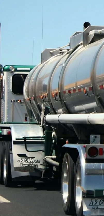 Shiny tanker truck on highway mobile wallpaper.