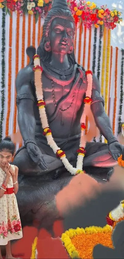 Majestic Shiva statue adorned with flowers.