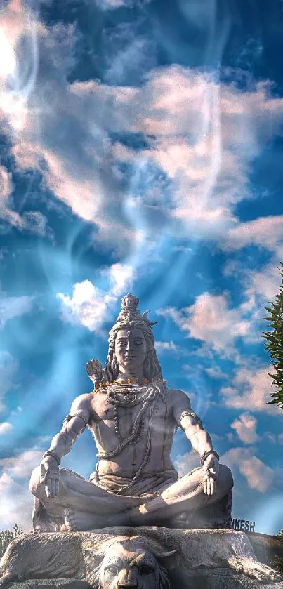 Serene Shiva statue under a majestic cloudy sky for mobile wallpaper.