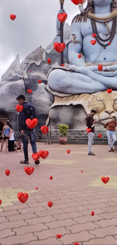 A large Shiva statue with animated red hearts.