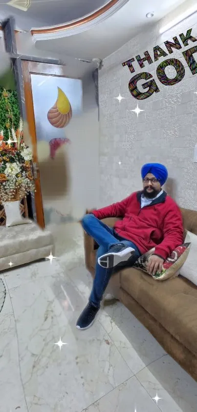 Sikh man relaxing on a couch in a stylish room with 'Thank God' text.