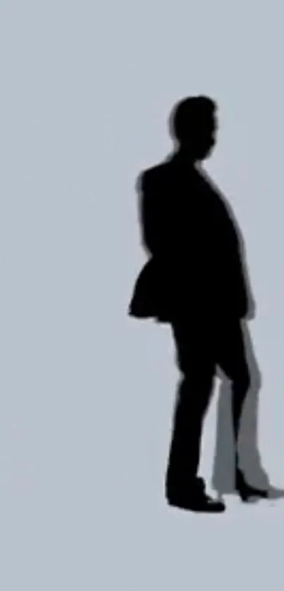 Silhouette of a person on a light gray background wallpaper.