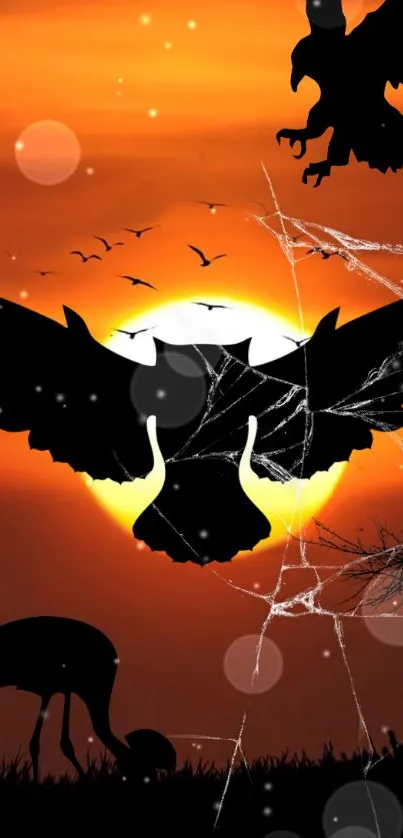 Mobile wallpaper featuring bird silhouettes at sunset with an orange sky.