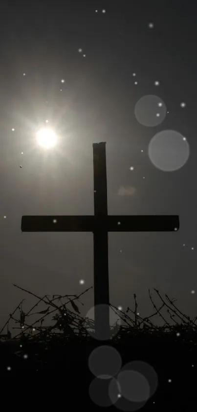 Silhouette of a cross against a glowing sunset sky with contrasting dark elements.